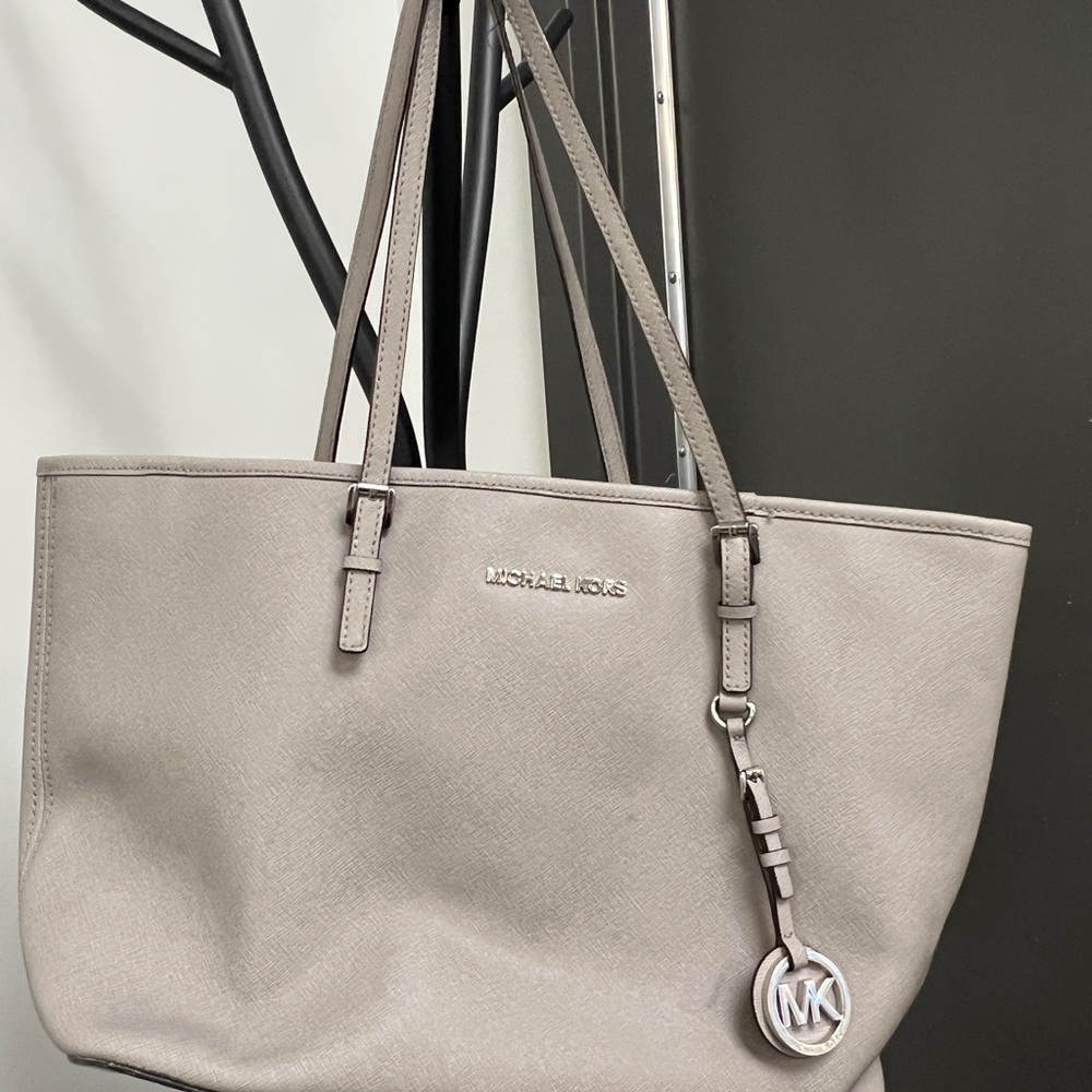 Michael Kors purse used condition, makeup stains inside.